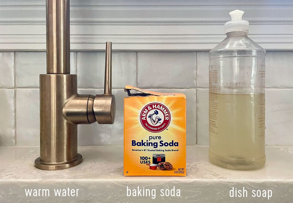 3 Supplies for cleaning a stainless steel sink warm water baking soda dish soap