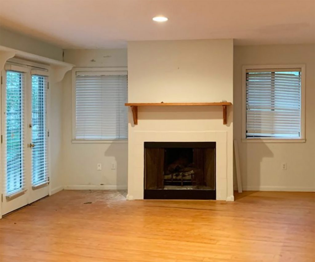 Before photo of fireplace in living room turned bedroom