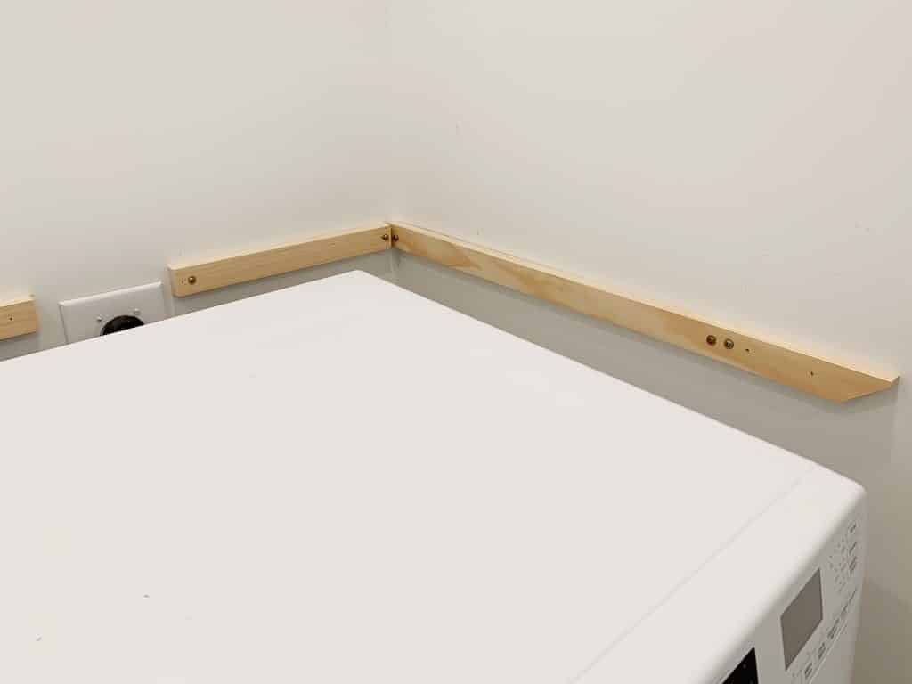 Side view of wall support for DIY laundry shelves