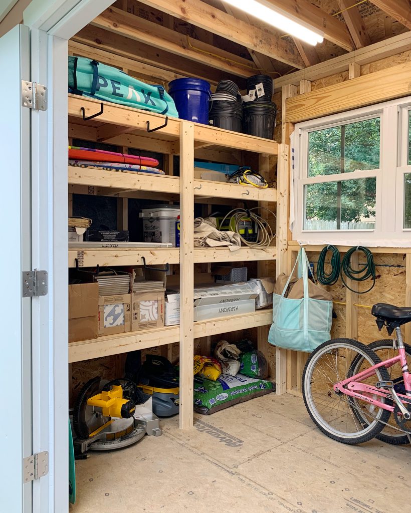 Heavy duty wood shelves in beach house storage shed