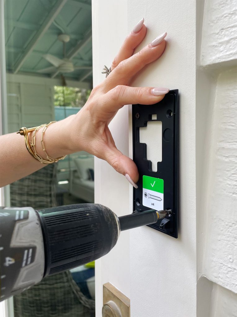 Screwing Ring Doorbell Mounting Plate To Front Door Frame