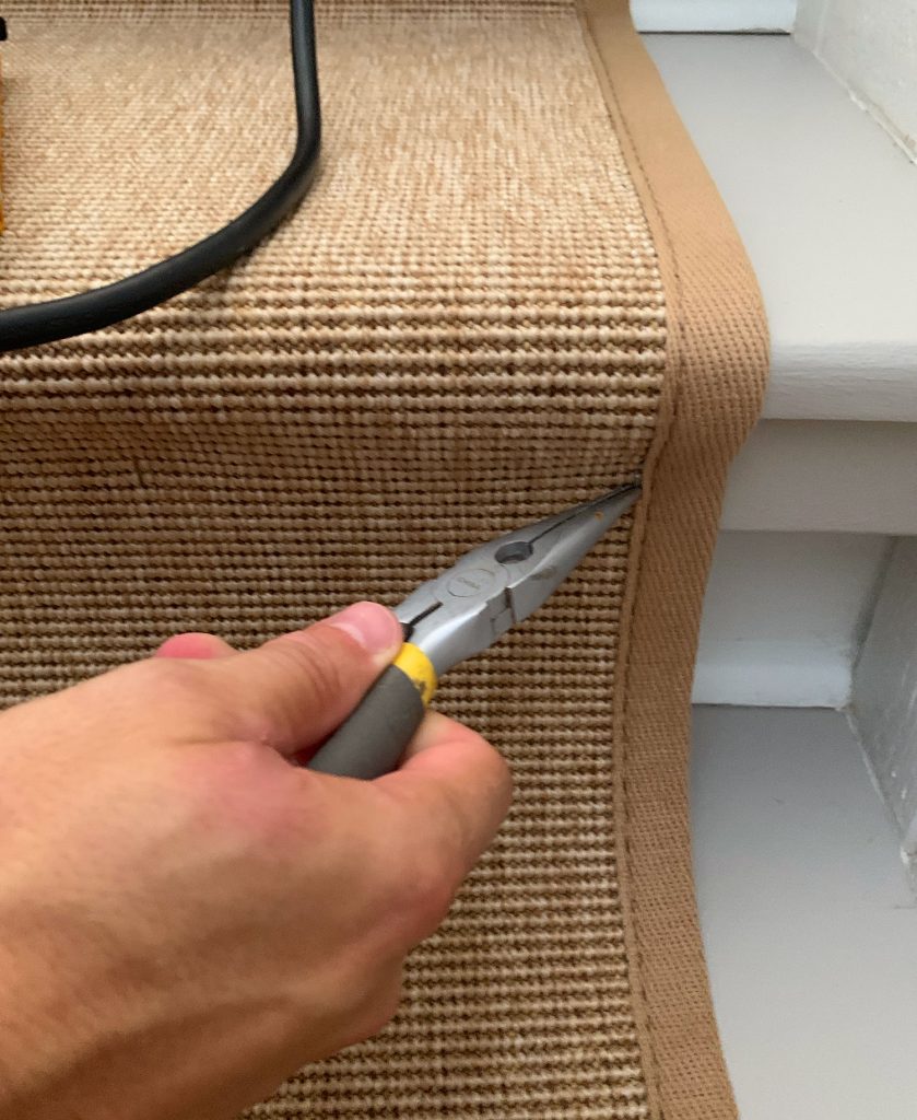 Needlenose Pliers Removing Staple On Sisal Stair Runner