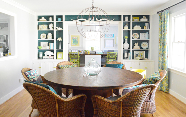 Previous home with built-in bookshelves in dining room with colorful background