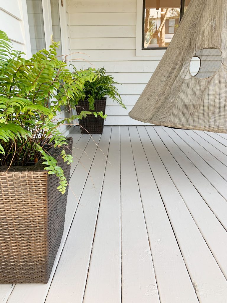 Finished painted gray porch floor detail