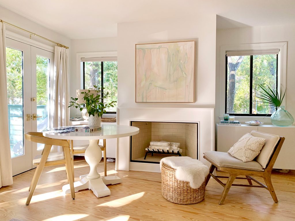 Main Bedroom With Two Windows Next To Fireplace And Curtains On French Doors