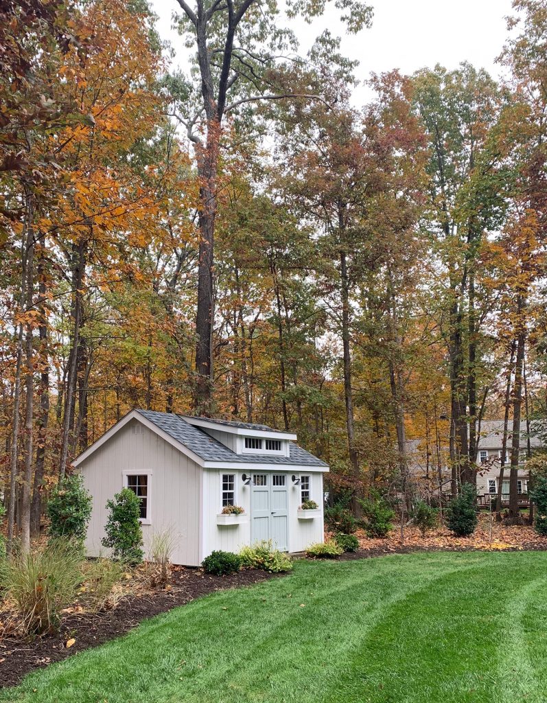 Painted White Shed Fall Leaves