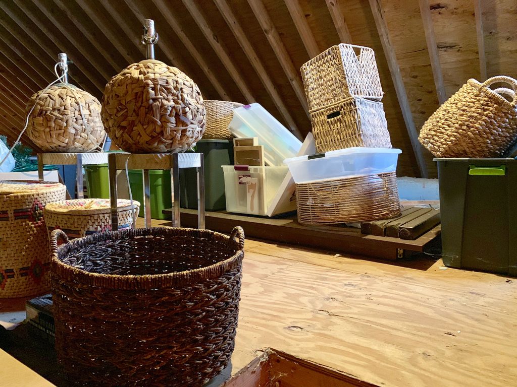 Attic with various wicker baskets and lamps