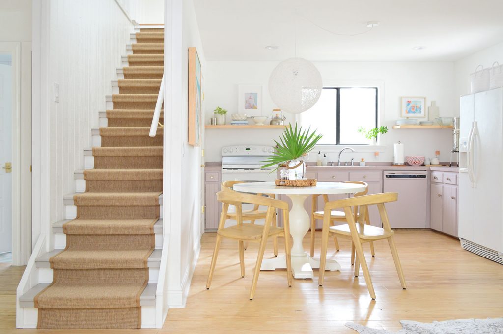 Kitchen With Mauve Cabinets And Stairs With Sisal Runner