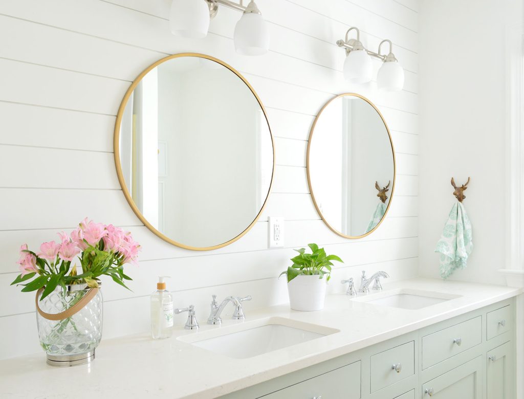 Bathroom With Extra White Shiplap Walls And Green Cabinets